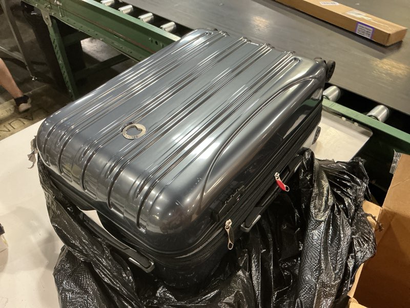 Condition photo showing As Is for delsey paris helium aero hardside expandable luggage with spinner wheels, titanium, carry-on plus 21 inch titanium carry-on plus 21 inch