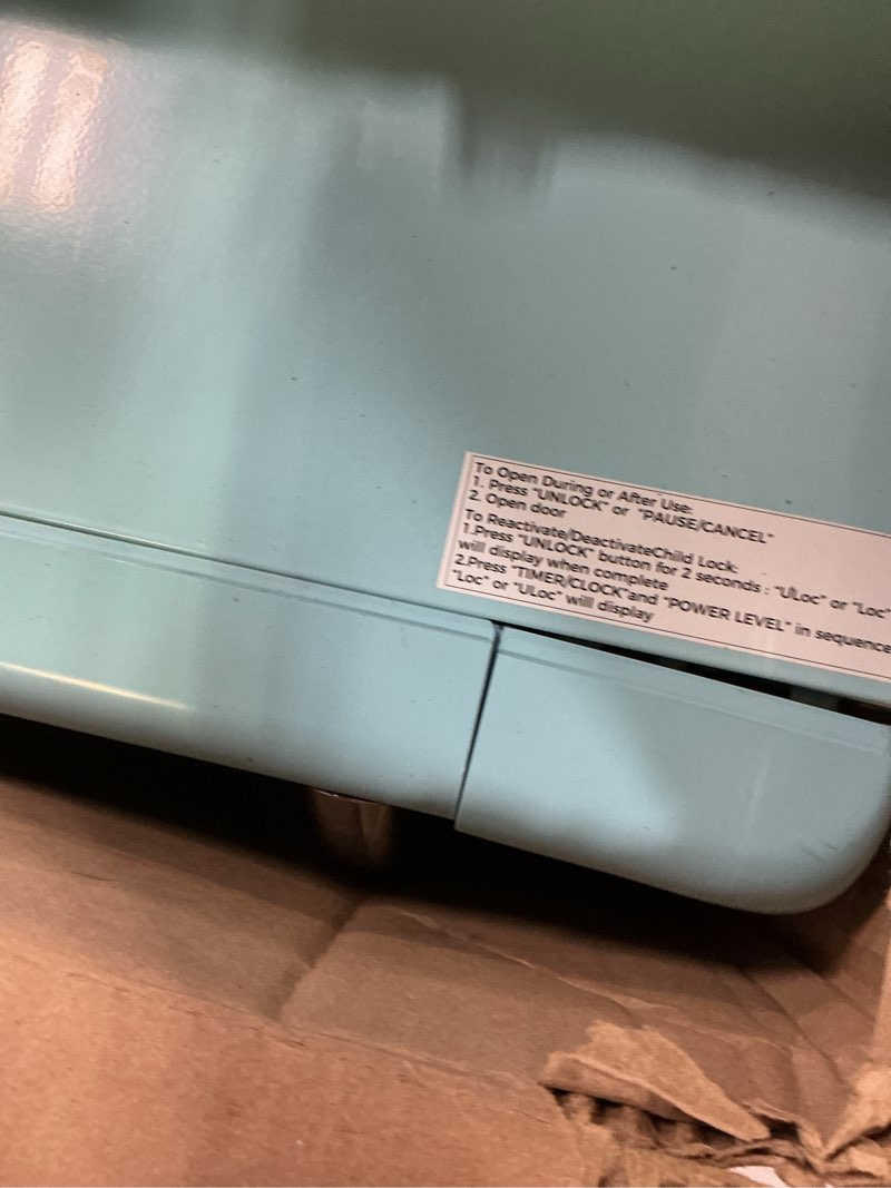 Condition photo showing As Is for Galanz GLCMKA07BER-07 Retro Microwave Oven, LED Lighting, Pull Handle Design, Child Lock, Bebop Blue, 0.7 cu ft Blue .7 cu ft Classic Microwave Oven