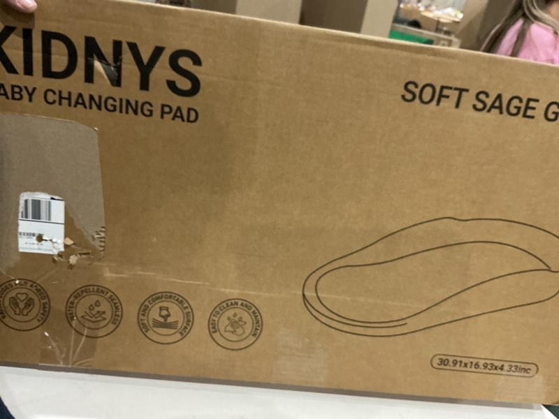 Condition photo showing New/Like New for kidnys waterproof baby changing pad with extra-high edges - adjustable & removable safety belt - wipe-clean surface & non-slip base - comfort, ergonomic & playful design - soft sage green