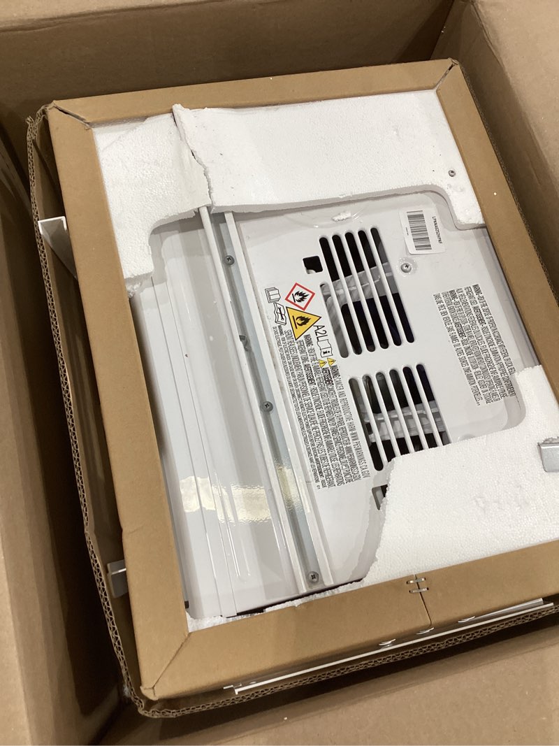 Condition photo showing As Is for amazon basics 6000-btu window air conditioner with quiet operation, up to 250 sqf, cool and fan functions, washable filter, adjustable window kit, digital temperature display, remote control, white