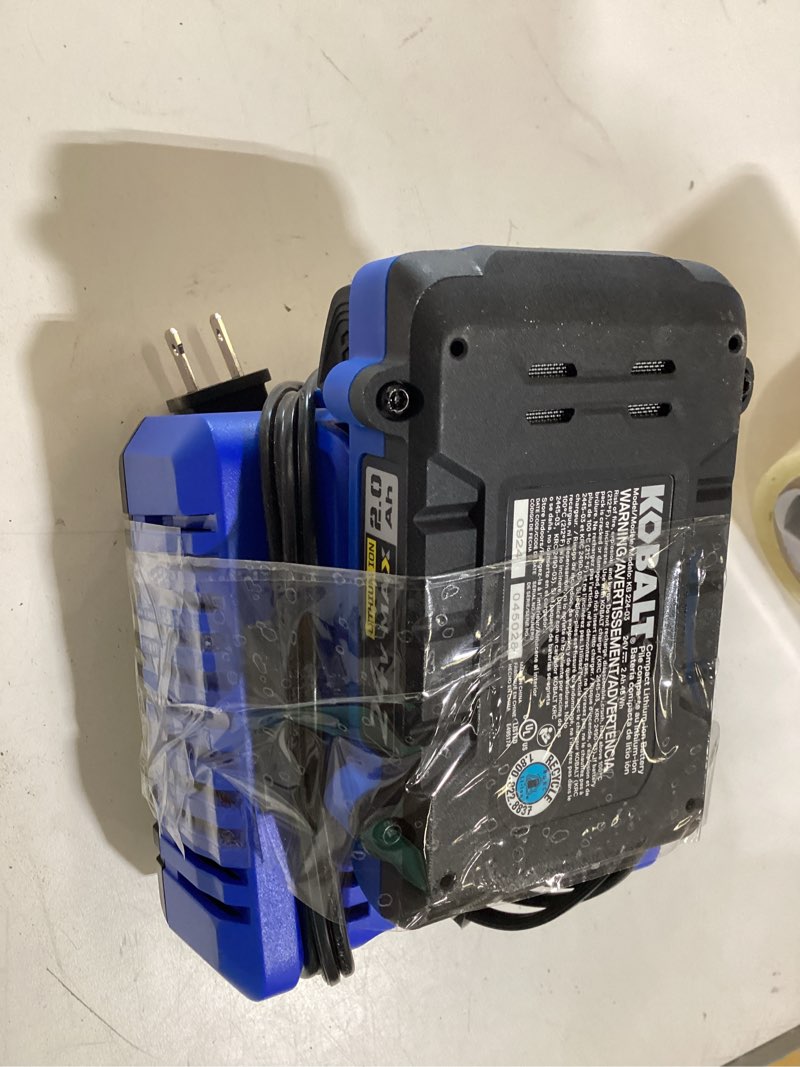 Condition photo showing As Is for kobalt 24v max 2.0 ah battery and charger