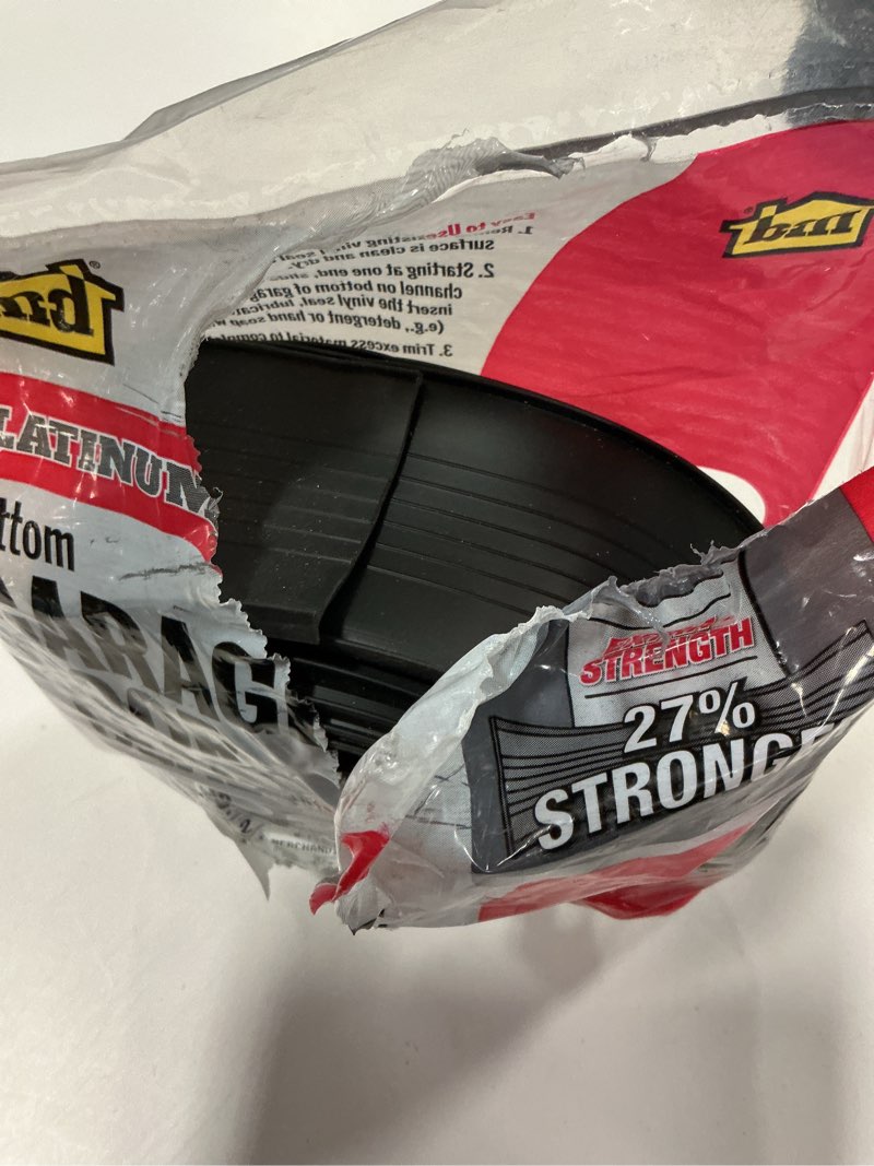 Condition photo showing As Is for PLATINUM™/FLEX ALLOY® 2.5 in. x 18 ft. Black Vinyl Replacement for Garage Door Weatherstripping