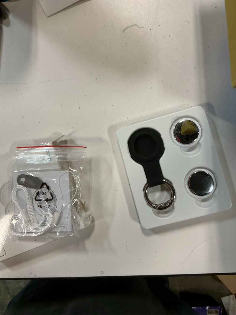 Condition photo showing Good Condition for air tracker tag 2 pack [apple mfi certified] with find my(ios only), key finder with no app needed, waterproof, 365-day standby,wallet key bag luggage tracker silver