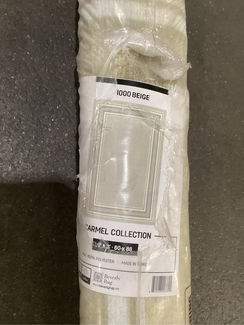 Condition photo showing New/Like New for Beige rug 2’x3’