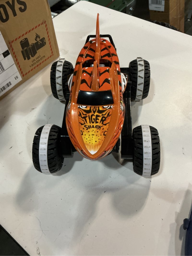 Condition photo showing Good Condition for Hot Wheels RC Toy, Remote-Control Monster Trucks Unstoppable Tiger Shark in 1:15 Scale with Terrain Action Tires