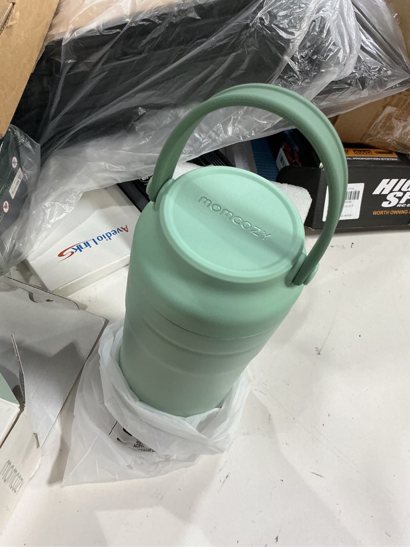 Condition photo showing New/Like New for momcozy 22oz portable breast milk cooler for outdoor, life saver with 360° total cooling for 24 hours, larger capacity travel breastmilk chiller with 2pcs baby bottles for breastmilk storage, green green 22oz