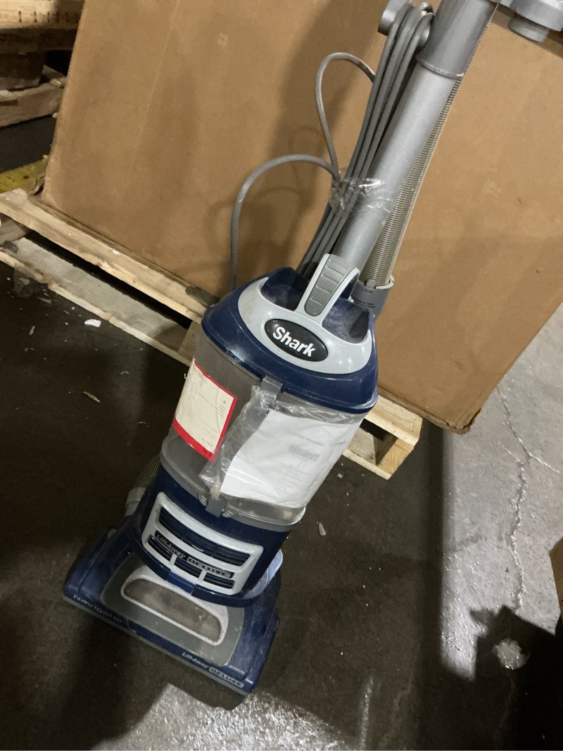 Condition photo showing As Is for (powers on) shark upright vacuum, navigator lift-away deluxe with large dust cup capacity, hepa filter, swivel steering, upholstery tool & crevice tool, blue, nv360