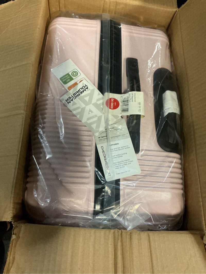 Condition photo showing New/Like New for american tourister nxt hardside large checked spinner suitcase - pink