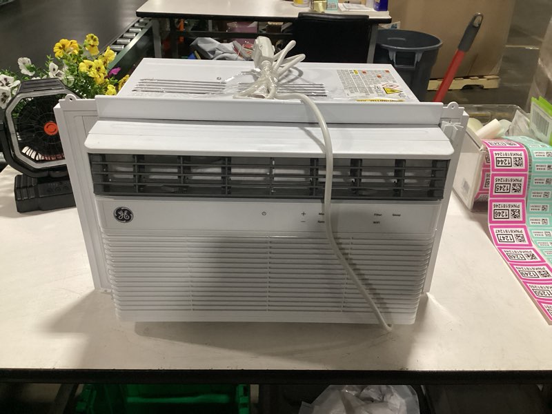 Condition photo showing As Is for 12,000 btu smart window air conditioner for 550 sq. ft. in white with wi-fi and remote (missing remote)