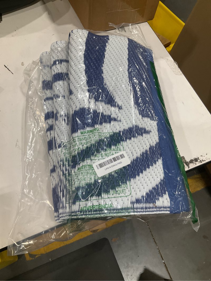 Condition photo showing Good Condition for yonile outdoor patio rug, 4x6ft waterproof reversible large area rugs plastic straw mats for rv, for rv, picnic, backyard, deck, balcony, porch, beach blue&white 4x6ft