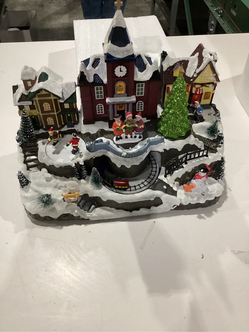 Condition photo showing Good Condition for Valery Madelyn Christmas Village Decorations, Battery Operated Musical House, LED Lights Dynamic Trains Winter Scenes Figurine Retro Choir Town Gift for Christmas Decoration, 10.8 Inch