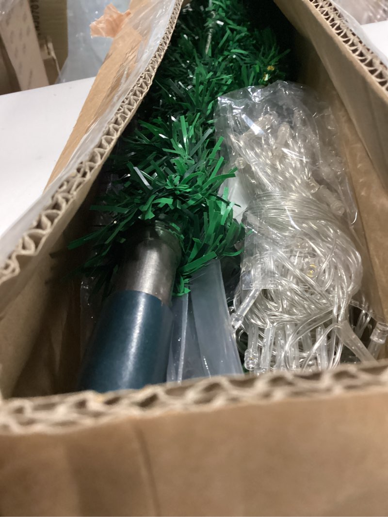 Condition photo showing As Is for Liliful 4ft Pre Lit Artificial Christmas Tree with Plug in 70 LED arm White Light Xmas Pencil Tree nclude Metal Foldable Stand for Home Xmas Party Decor(Multicolor Light)