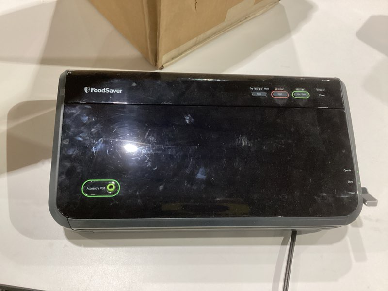 Condition photo showing As Is for FoodSaver Vacuum Sealer Machine, Automatic Bag Detection, Sous Vide Friendly, with sealer bags, roll, handheld vacuum sealer, black Vacuum Sealer + Accessories, NOT TESTED