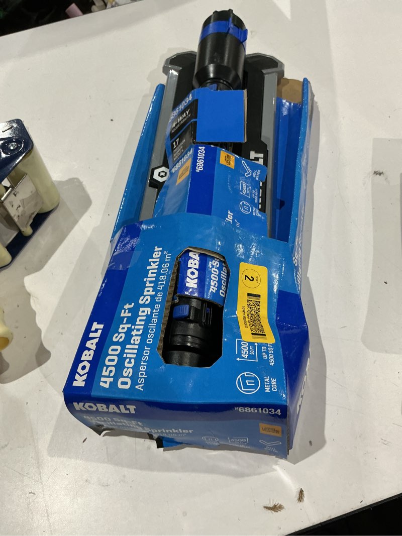 Condition photo showing As Is for kobalt lawn sprinkler 4000-sq ft oscillating lawn sprinkler