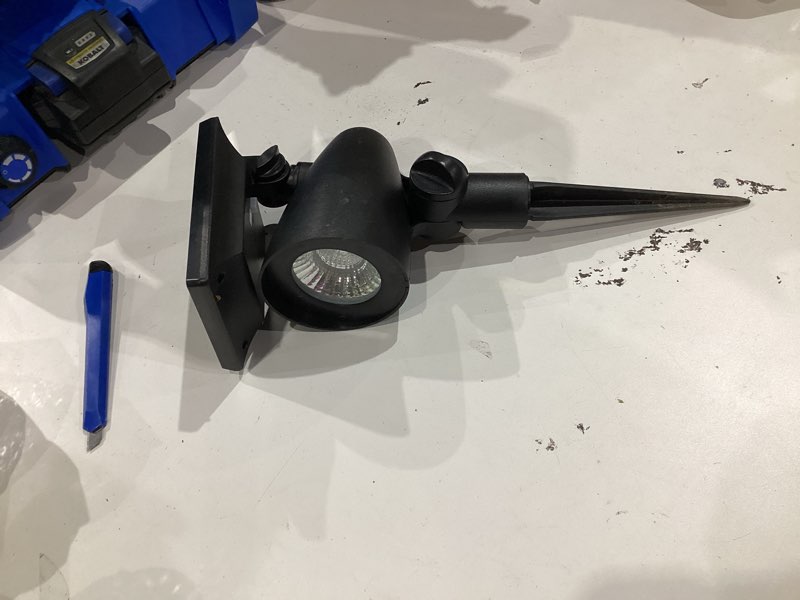 Condition photo showing As Is for harbor breeze 60 -lumens 1 -watt black warm white solar led spot light