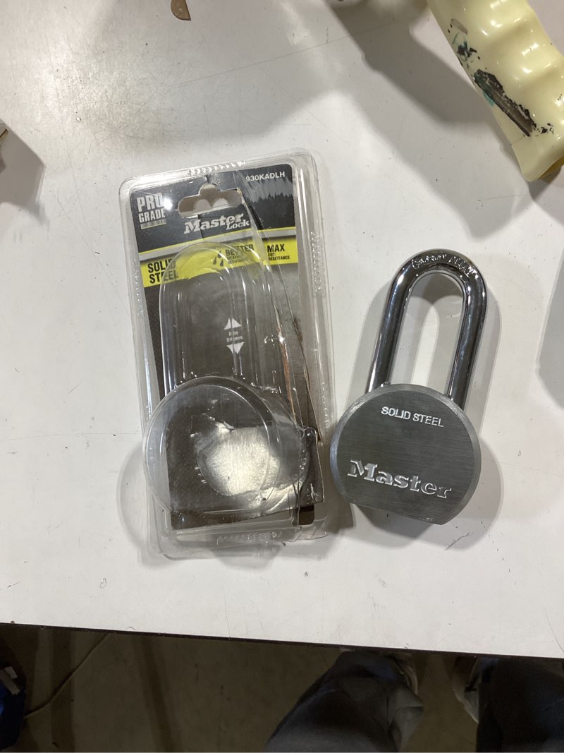 Condition photo showing As Is for master lock heavy duty outdoor keyed padlock, 2-1/2-in wide x 2-in shackle