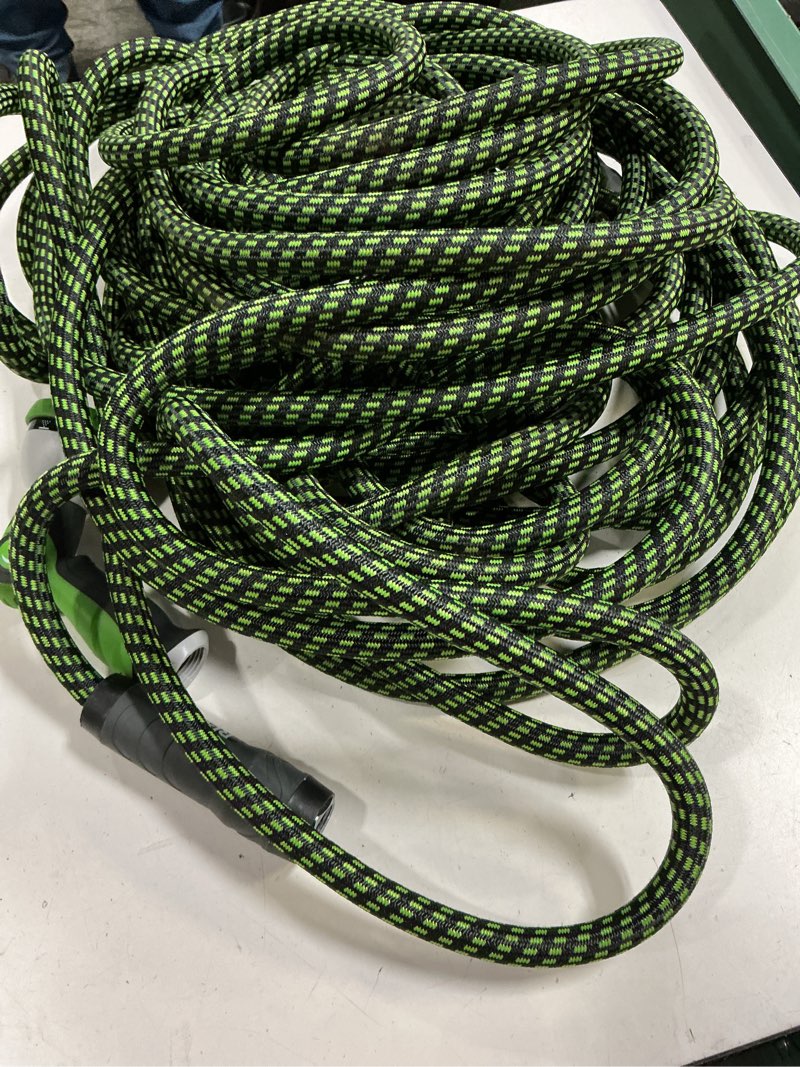 Condition photo showing As Is for garden hose, flexible ultra lightweight durable, kink-free water hose with 10 function sprayer - non-shrinking, easy to store, all-weather, high-pressure (100 ft) green 100ft