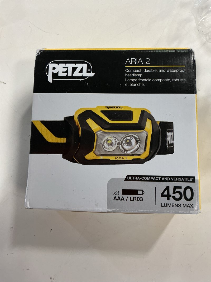 Condition photo showing New/Like New for PETZL ARIA 2 RGB, Compact, Durable, Waterproof headlamp with White, red, Green and Blue Modes, 450 lumens