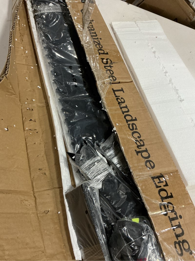 Condition photo showing Good Condition for a anleolife 6 pack 40" lx 6" h galvanized steel garden landscape edging, black powder coated bendable hammer-in lawn border with gloves and 10 stakes (20ft total) (6 inch tall, wavy edge, black) black 6 inch tall, wavy edge