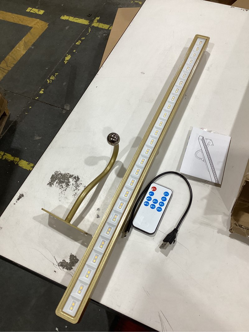 Condition photo showing Good Condition for 24 inch picture light for wall - battery operated wireless wall sconce with remote & timer for artwork, portrait, photo & frame (antque gold) antique gold 24in-1pack