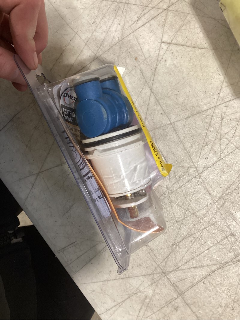 Condition photo showing As Is for danco  hot and cold  faucet cartridge  for delta