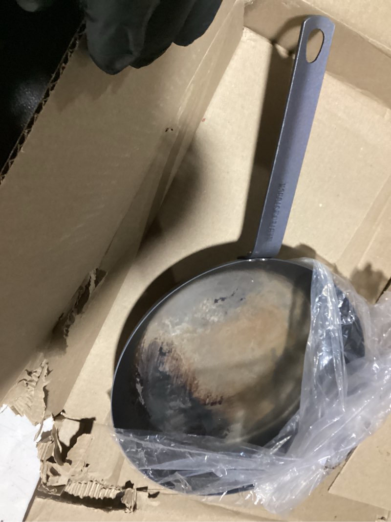 Condition photo showing As Is for As is Merten & Storck Pre-Seasoned Carbon Steel 12” Frying Pan Skillet, Use on Induction, Stove and Grill, Durable, Even-Heating, for Searing, Grilling, Oven Use, and Campfire, Indoor/Outdoor 12\" Frying Pan Skillet Black