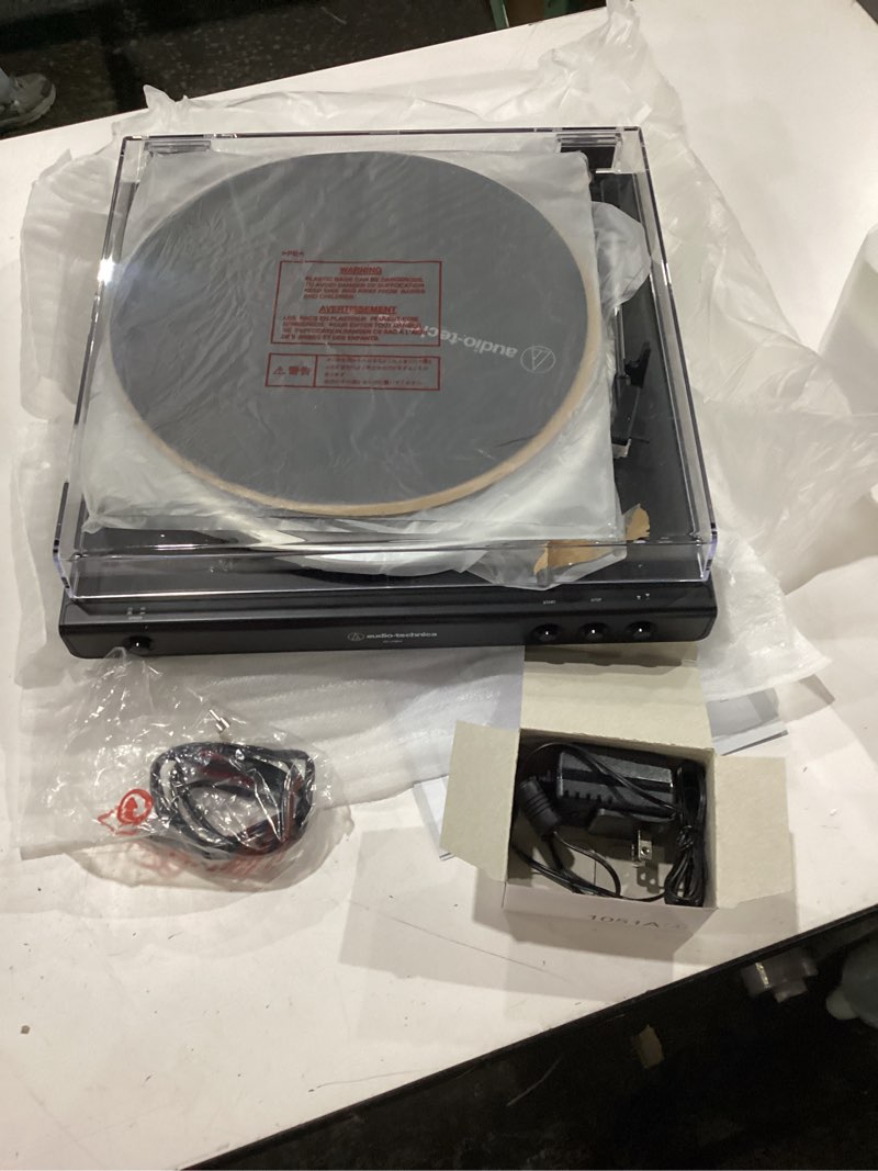 Condition photo showing New/Like New for audio-technica at-lp60x-bk fully automatic belt-drive stereo turntable, black, hi-fi, 2 speed, dust cover, anti-resonance, die-cast aluminum platter black wired turntable