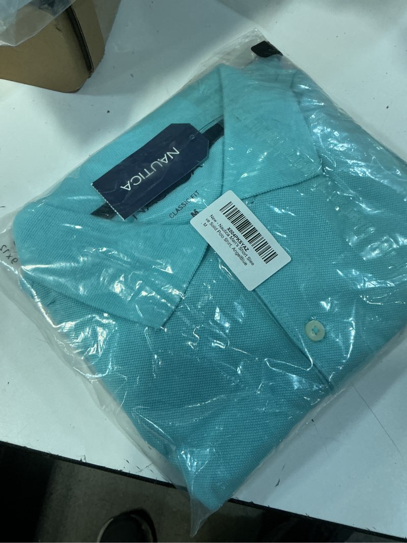 Condition photo showing New/Like New for nautica men's classic short sleeve solid performance deck polo shirt medium angel blue