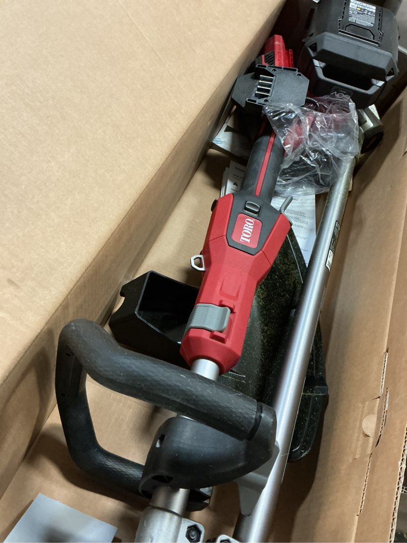 Condition photo showing As Is for toro 51837 16 in. 60 v battery string trimmer kit (battery & charger)