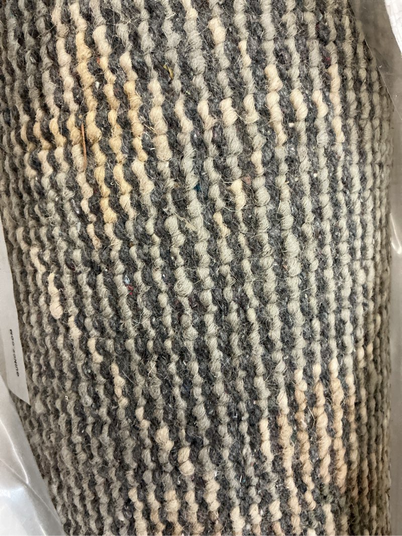 Multi colored woven area rug 5’