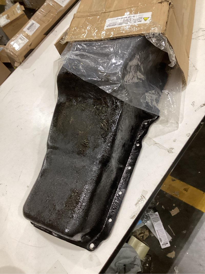 Condition photo showing As Is for The item in the image is an engine oil pan, commonly used for automotive vehicles like Jeep Wranglers or Ford engines