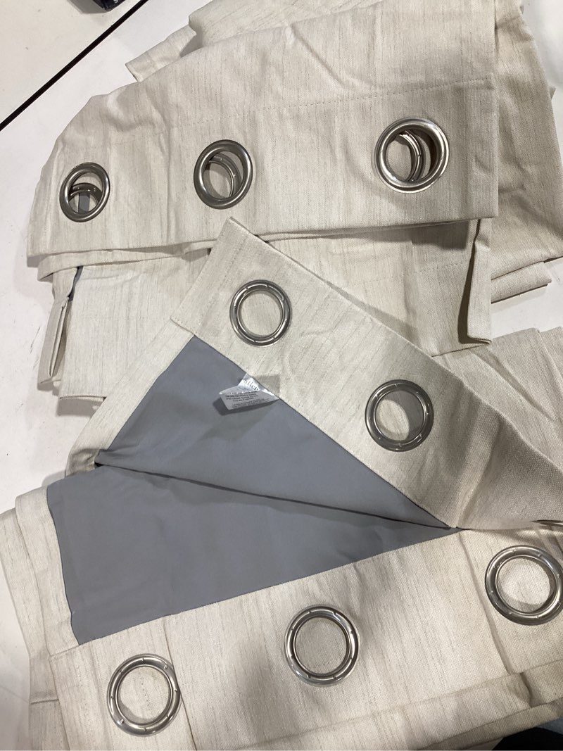 Condition photo showing Good Condition for allen + roth 84-in parchment blackout grommet curtain panel pair