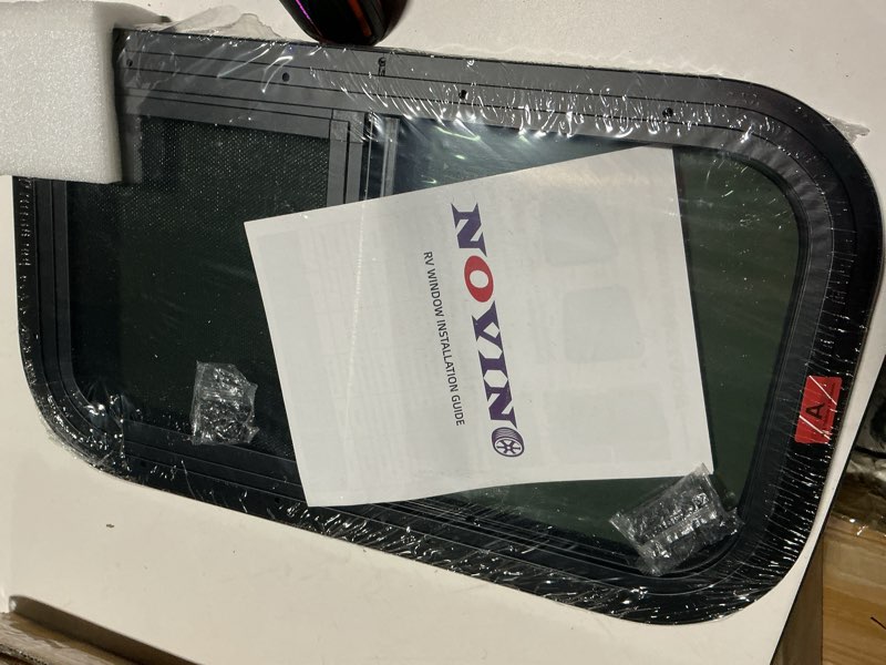 Condition photo showing Good Condition for vertical rv window, 12" w x 22" h tinted sliding rv window with net screen and trim ring, suitable for 15/16" or 1-3/8" and slightly thicker up to 1/16" walls, dot approved 12x22in 1