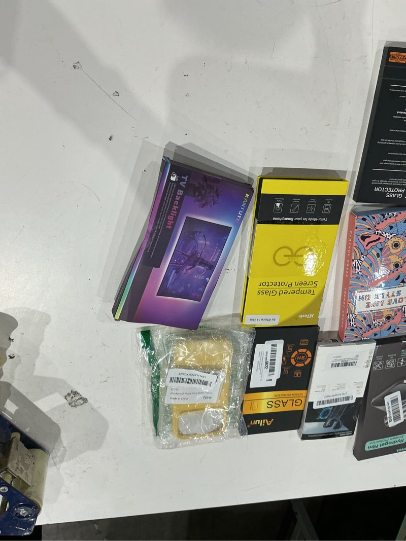 Condition photo showing As Is for assorted cellphone/tablet/laptop case covers & accessories
