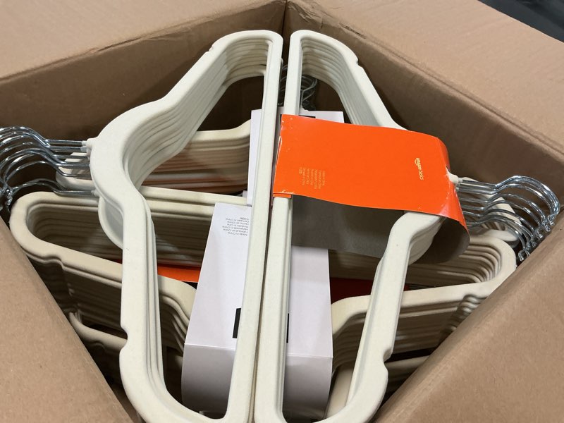 Condition photo showing Good Condition for Amazon Basics Slim, Velvet, Non-Slip, Space-Saving Suit Clothes Hangers, Pack of 100, Ivory/Beige Ivory/Beige Pack of 100