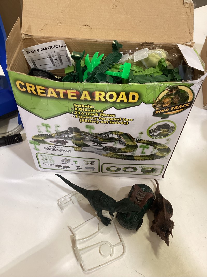 Condition photo showing As Is for dinosaur toys,create a dinosaur world road race,flexible track playset and 2 pcs cool dinosaur car for 3 4 5 6 year & up old boy girls best gift green