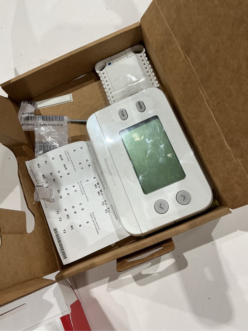 Condition photo showing As Is for honeywell home x1n heating and cooling push button non-programmable thermostat