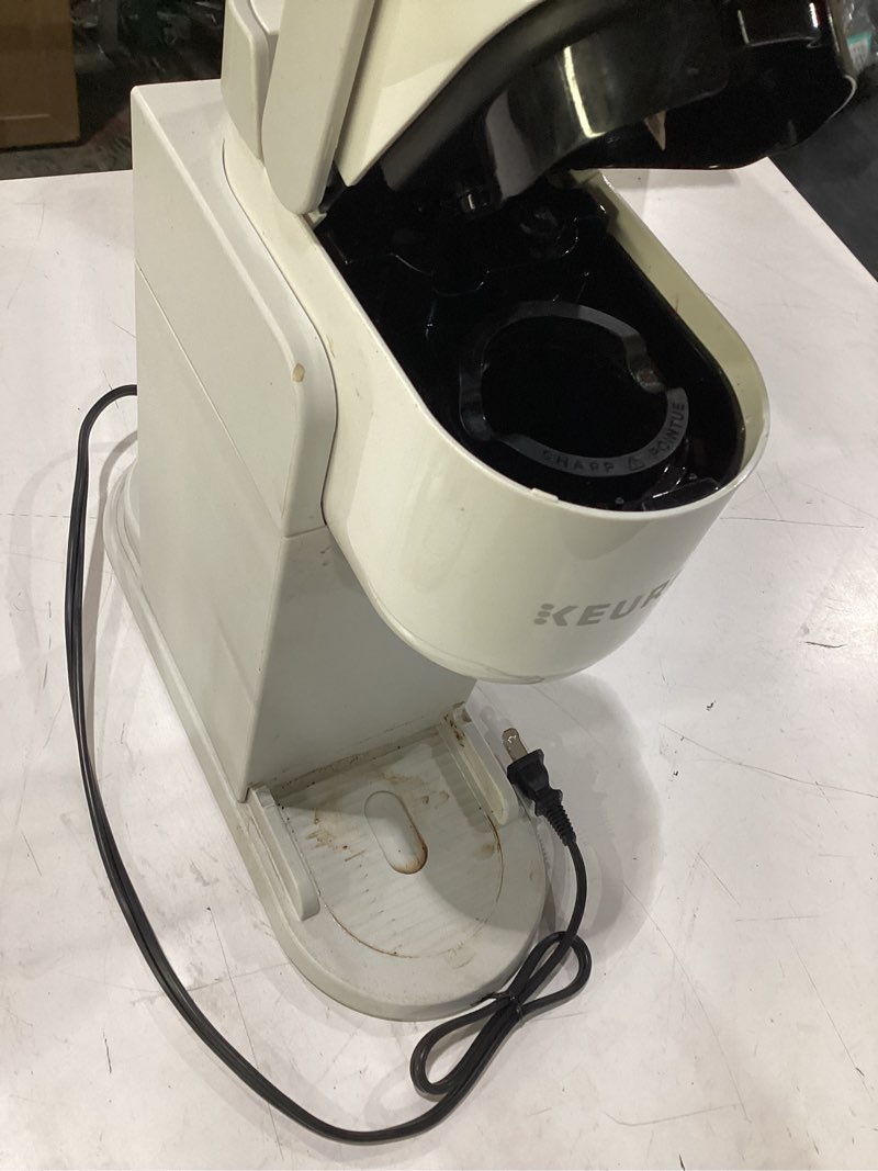 Condition photo showing As Is for **untested** keurig k-express single serve k-cup pod coffee maker, 3 brew sizes, strong button feature, 42oz removable reservoir, warm stone