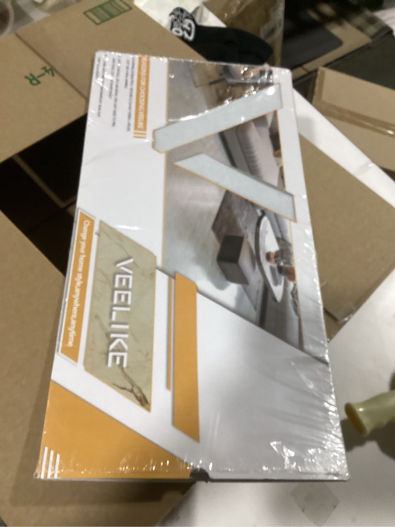 Condition photo showing As Is for VEELIKE 12"x24" Peel and Stick Floor Tile White Marble Waterproof Bathroom Stick on Tiles Flooring Self Adhesive Removable Vinyl Flooring Tile Stickers for Kitchen Backsplash Garage Bedroom 4 Pack Box of 4 tiles White