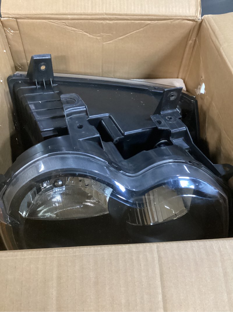 Condition photo showing As Is for weelmoto headlights for 2005-2007 jeep grand cherokee 4-dr headlamp replacement for 05 06 07 jeep grand cherokee headlight black housing amber reflector wiring harness included clear lens i black housing i amber reflector oe replacement