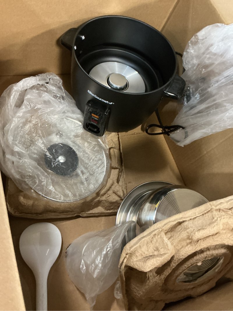 Condition photo showing As Is for Elite Gourmet ERC006SS 6-Cup Electric Rice Cooker with Stainless Steel Inner Pot, Makes Soups, Stews, Porridges, Grains and Cereals, 6 cup (3 cups uncooked), Black 6 Cups Cooked, Stainless Steel Black