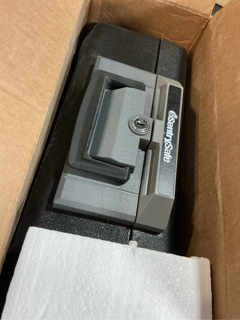 Condition photo showing Good Condition for sentrysafe fireproof safe box with key lock, chest safe with carrying handle to secure money, jewelry, documents, 0.25 cubic feet, 6.3 x 15.3 x 12.1 inches, 1160 fire resistant box 0.25 cu. ft.