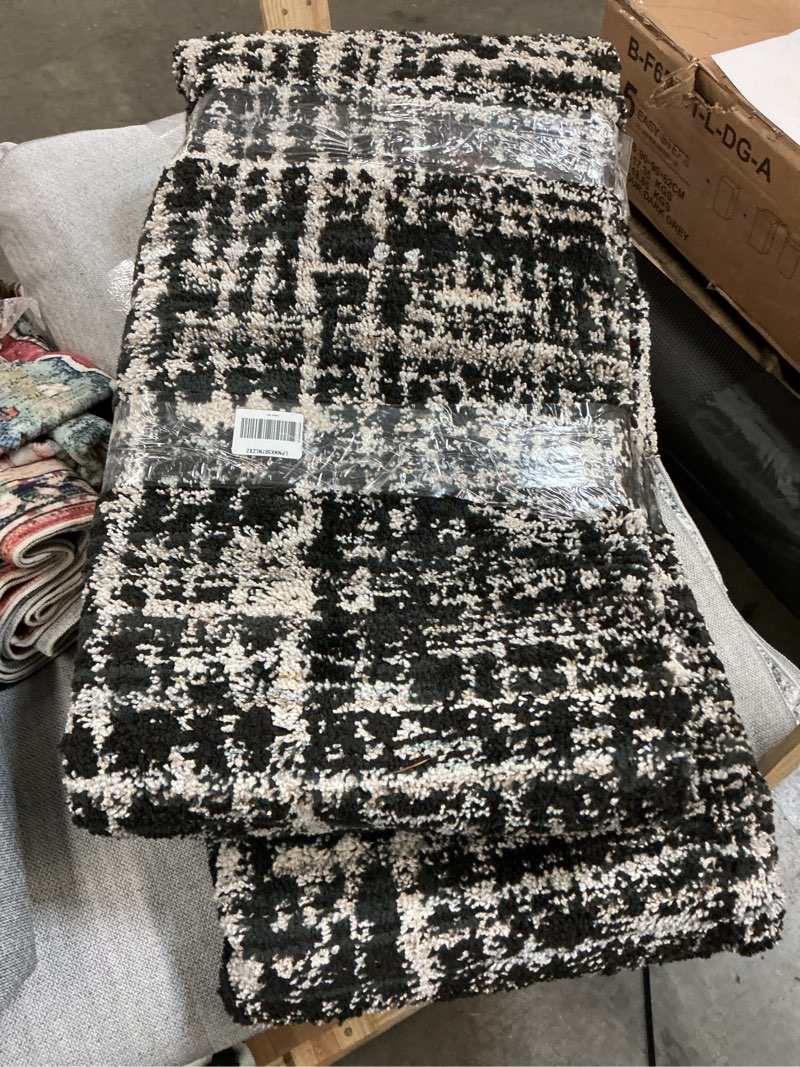 Condition photo showing As Is for Garland Rug Rumba Black/Earth Tones 8 Ft. X 10 Ft. Modern Abstract Area Rug – Soft, Anti-Skid,Carpet for Living Room, Bedroom, Dining Room, Farmhouse, Nursery –Non-Shedding Indoor Floor Rug Black / Earth Tones 8' x 10' (Rectangular)