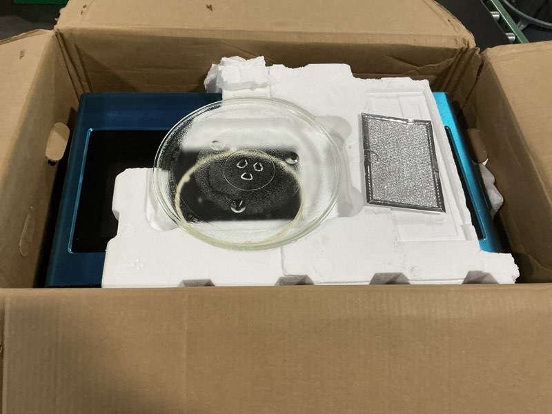 Condition photo showing As Is for over-the-range microwave