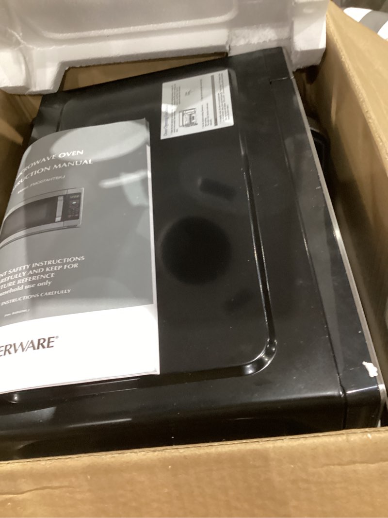 Condition photo showing Good Condition for farberware 0.7 cu. ft. countertop microwave oven – 700 watts power, auto cook settings, defrost, easy clean and child safety lock - stainless 0.7 cu. ft. stainless steel