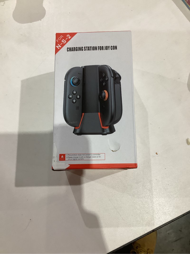 Condition photo showing New/Like New for Charging Dock for 2025 Nintendo Switch 2 JoyCon Controllers, 4-Slot Charger Station for Switch 2 Joy-Con Controllers, Magnetic & Weighted Base, LED Indicators, with USB-C Cable and 2 Wirst Strap