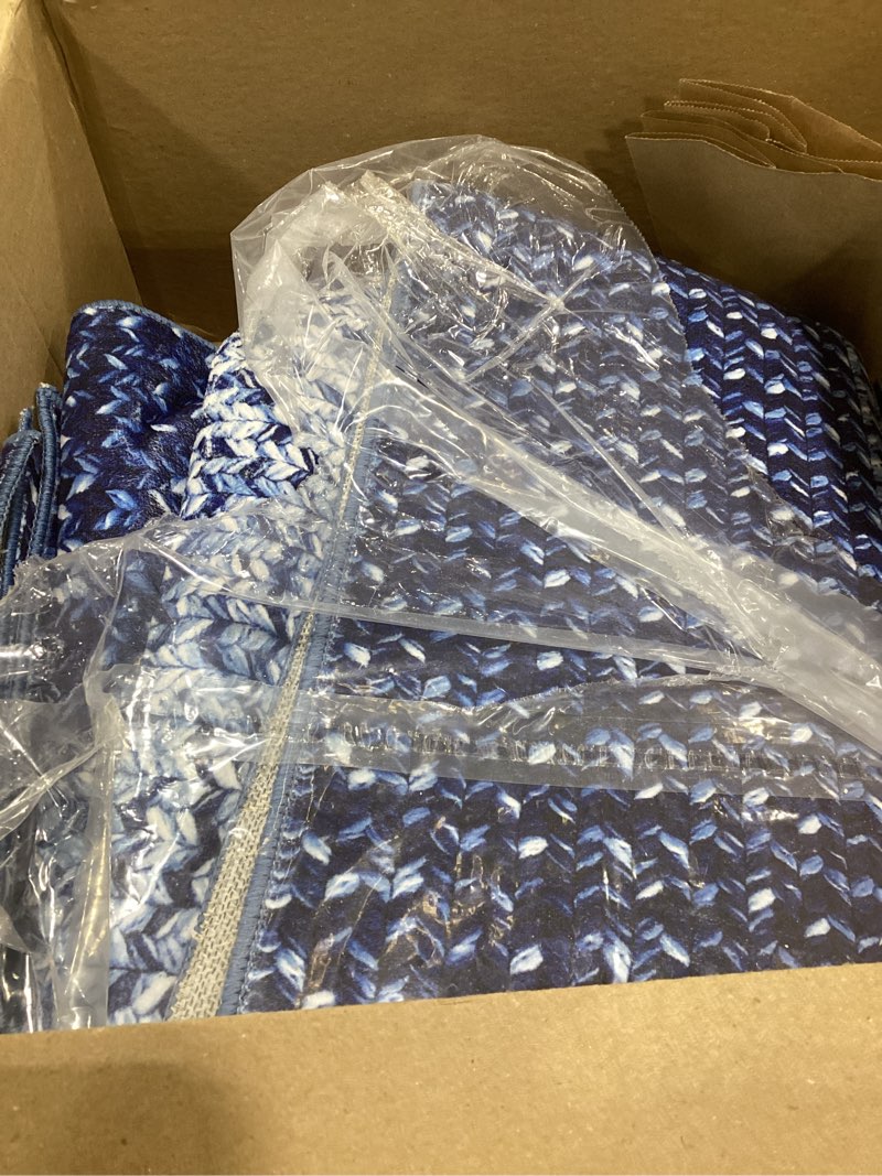 Condition photo showing Good Condition for This item appears to be a blue and white patterned area rug or throw blanket designed for home decor