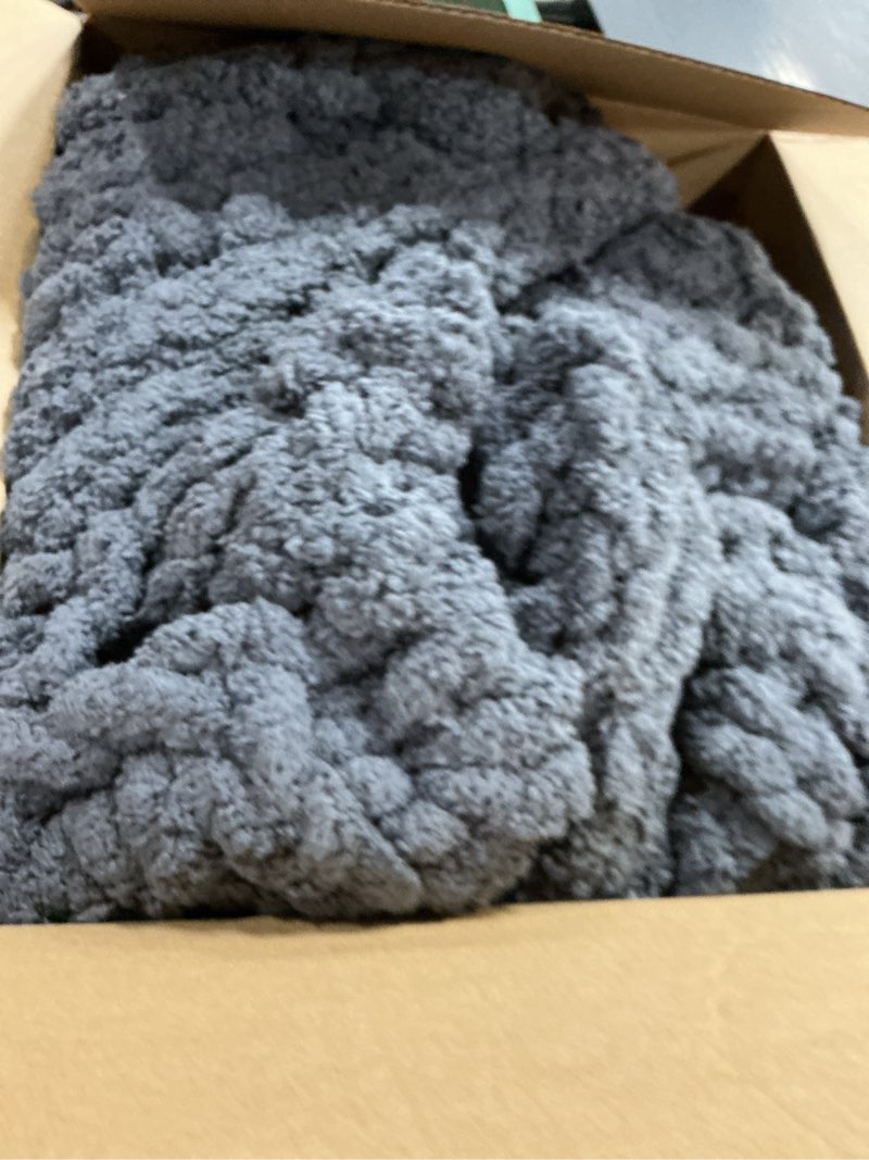 Condition photo showing As Is for L'AGRATY Chunky Knit Blanket Throw: 72''x84'' Chenille Chunky Knitted Throw Blanket for Bed Couch - Handmade Thick Big Cable Knit Blanket - Large Crochet Blankets for Home Decor(Dark Grey) Charcoal Grey 72"x84"