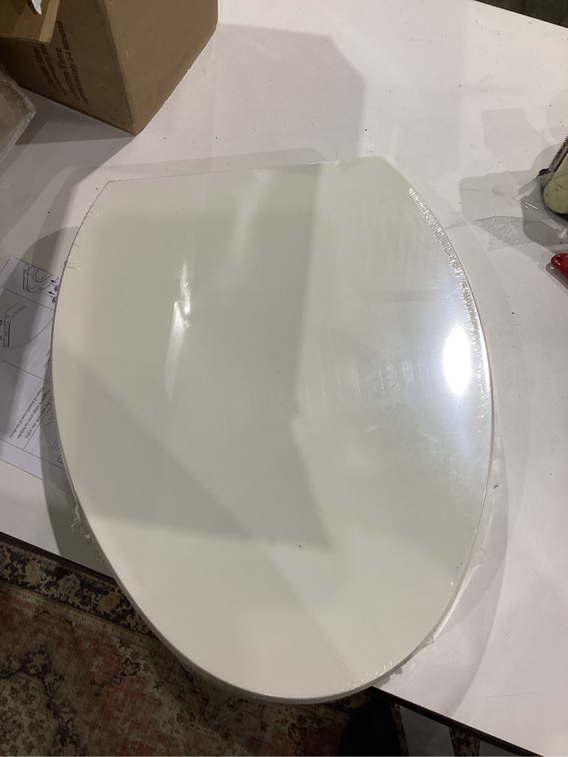 Condition photo showing Good Condition for kohler 25875-96 hyten 3" height, elevated soft close elongated toilet seat, contoured seat with grip-tight bumpers, quick-attach hardware, no slam toilet seat, biscuit biscuit elongated