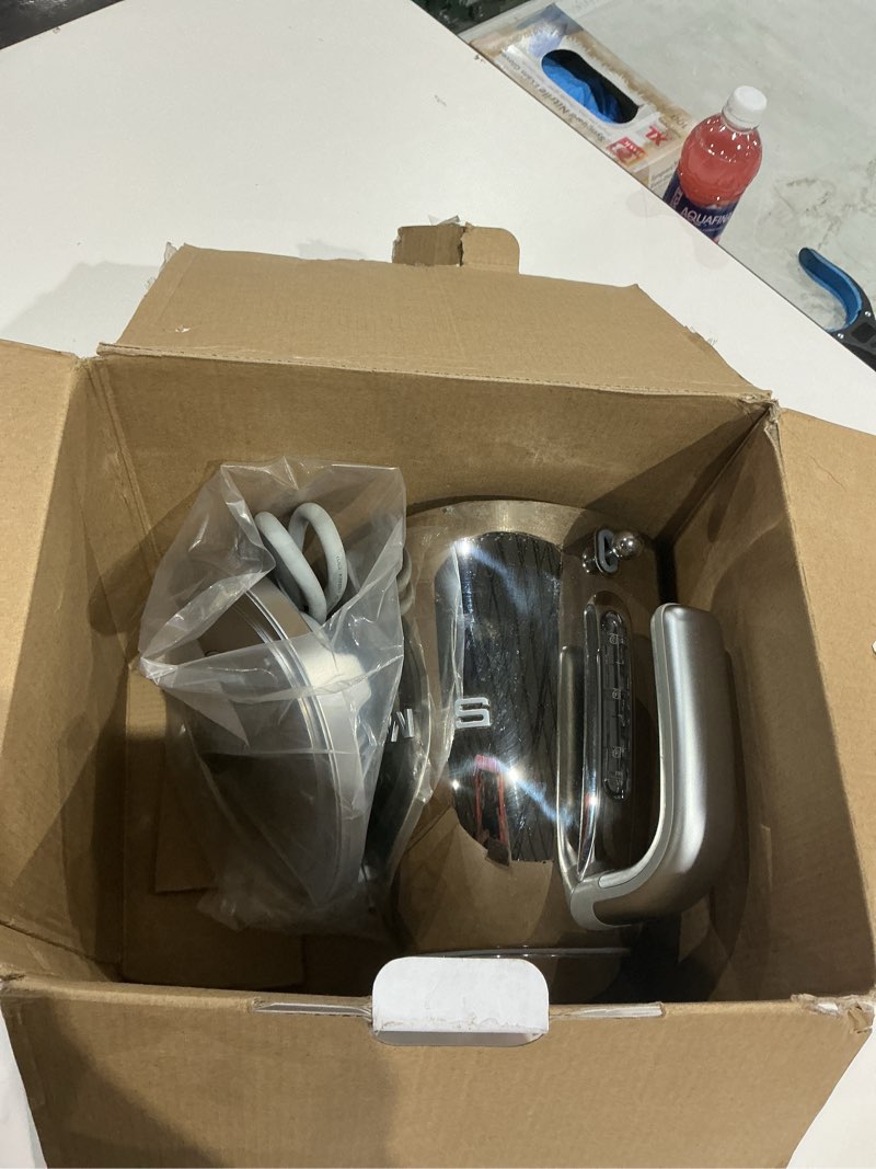 Condition photo showing As Is for smeg 50's retro style electric water kettle with automatic shutoff, removable base, and water indicator, klf03ssus, polished stainless steel 1.8 quarts chrome
